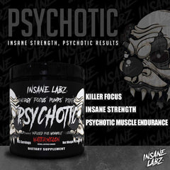 Shaker bottle with Psychotic Black Edition beside water for pre-workout use.