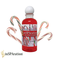 InSPAration spa liquid Holiday Candy Cane bottle close-up showing aloe vera formula