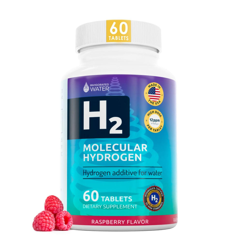 Invigorated Water raspberry tablets dissolving in a glass for a refreshing hydrogen-infused drink.