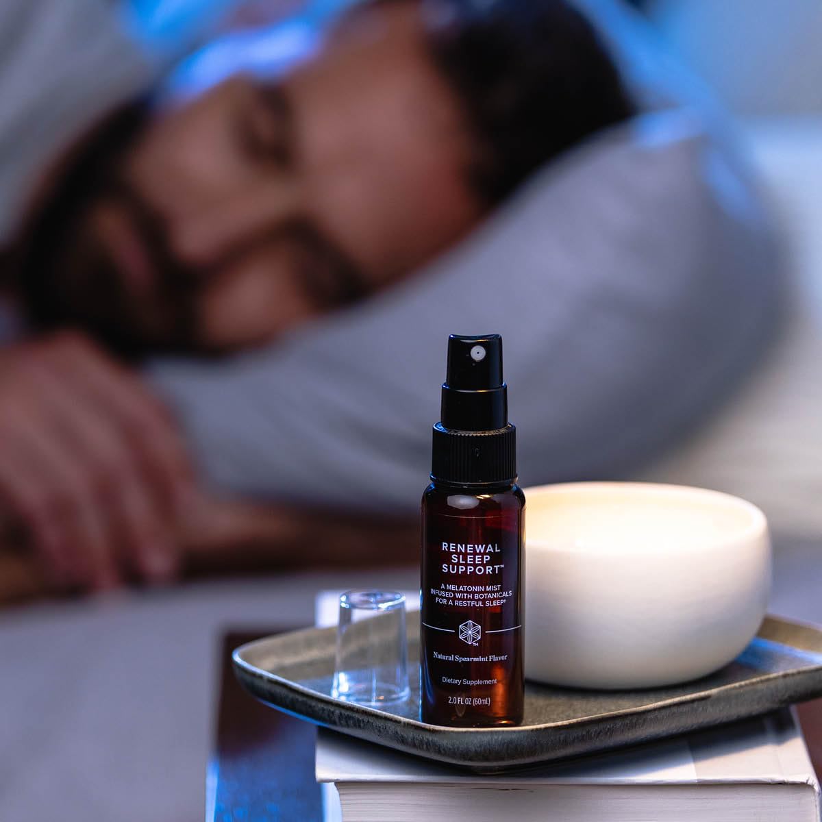 Isagenix Renewal Sleep Support spray in action mid-application.