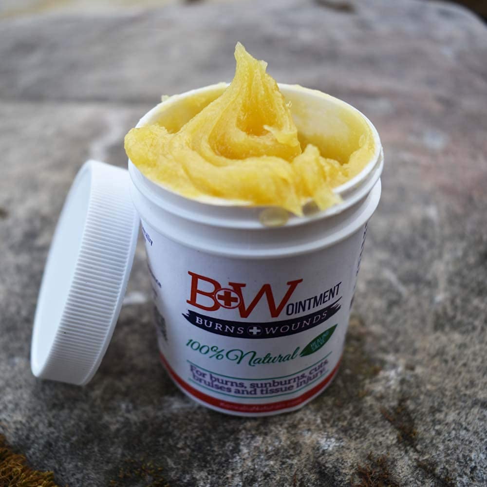 Close-up of B&W Ointment cream texture shows rich, concentrated healing.