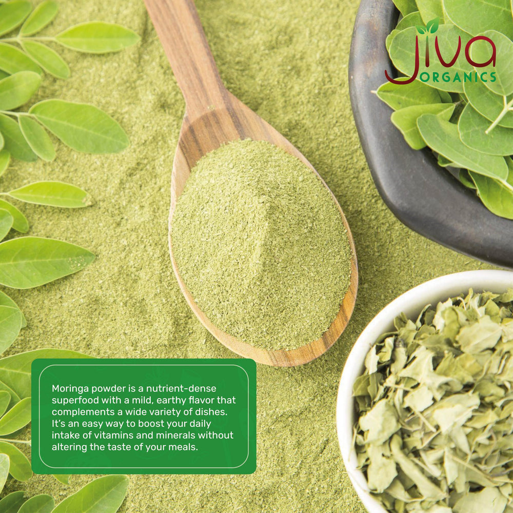 Green moringa smoothie bowl with powder addition.