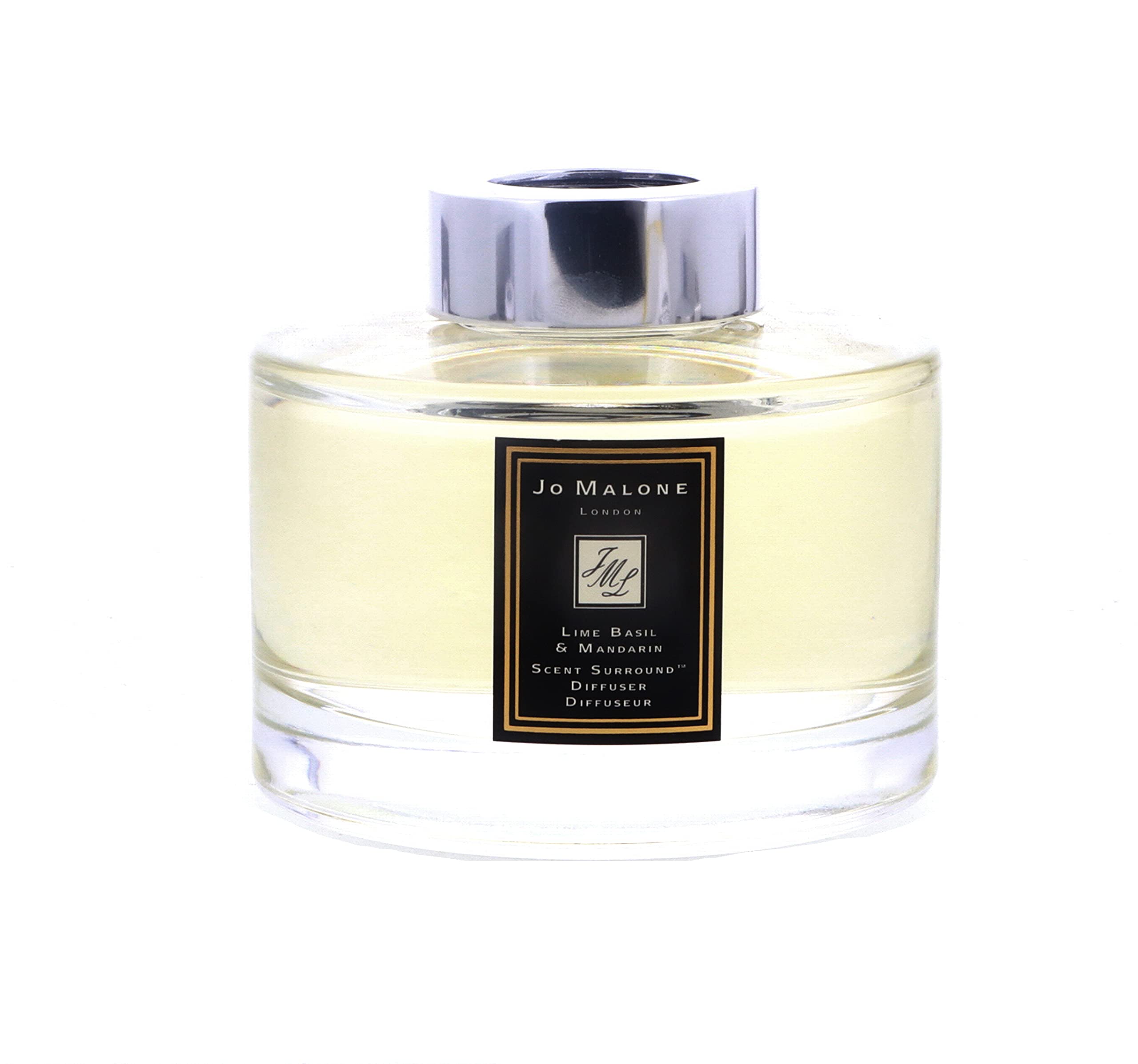 Jo Malone diffuser reeds close-up releasing a fresh scent in a modern space.