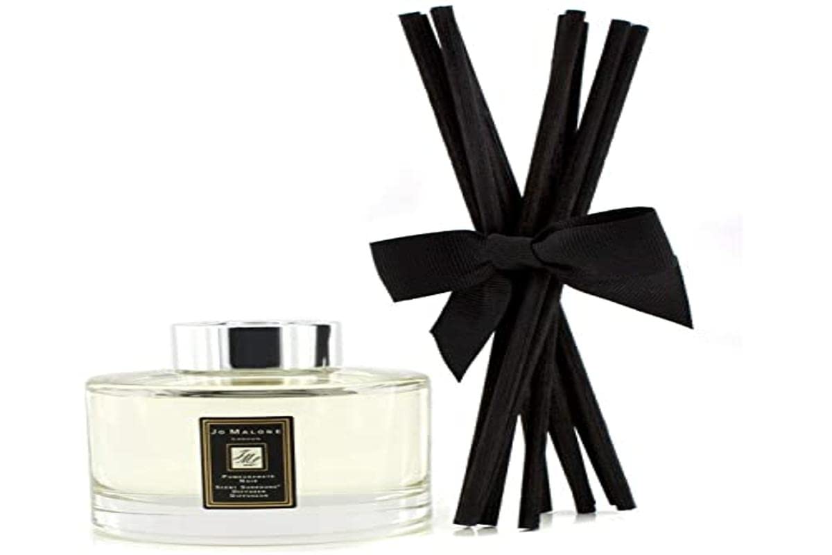 Jo Malone London Pomegranate Noir diffuser with reeds for lasting fruit notes.