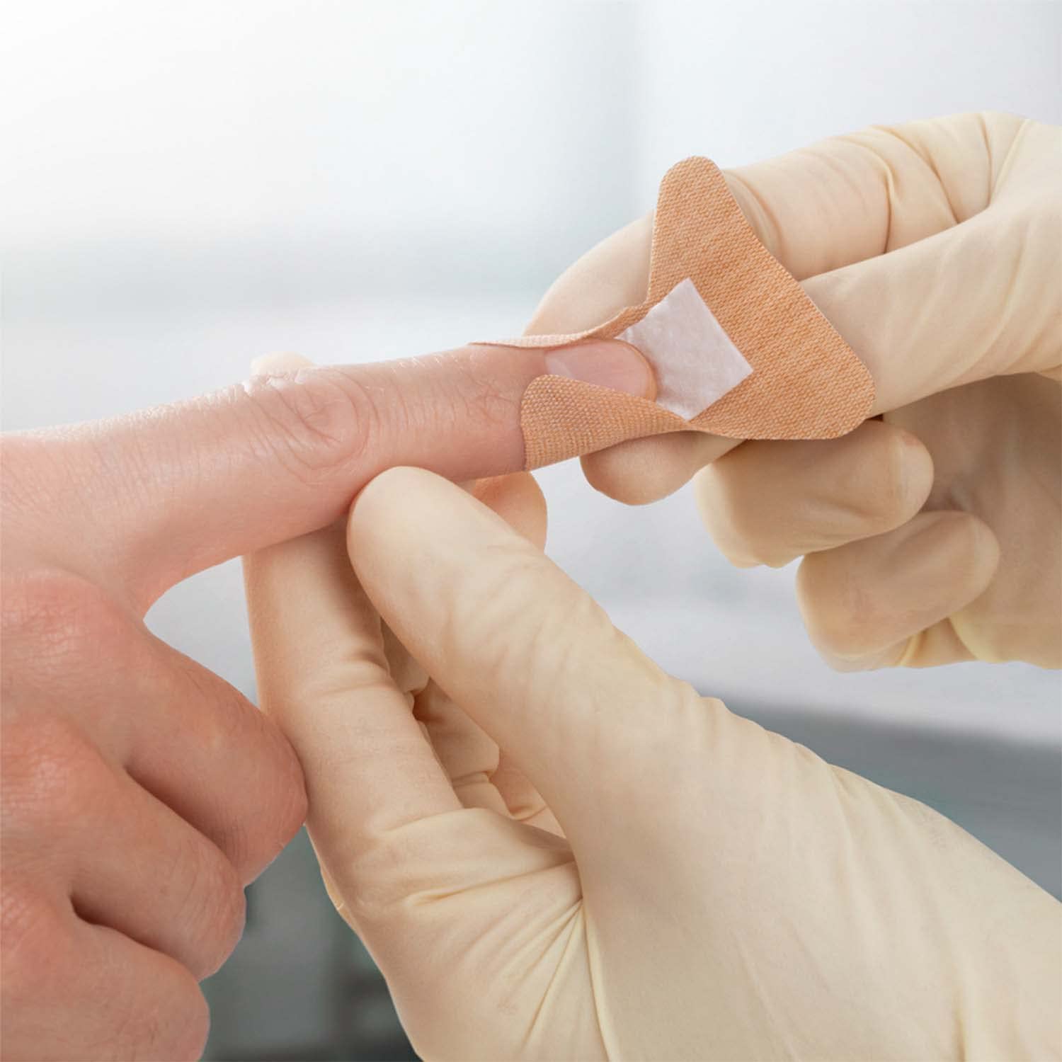 Jobst Leukoplast elastic bandage with soft wound pad prevents sticking to wounds.