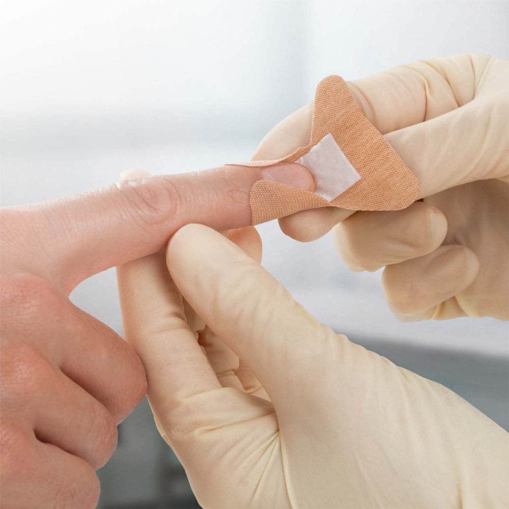 Jobst Leukoplast elastic bandage with soft wound pad prevents sticking to wounds.