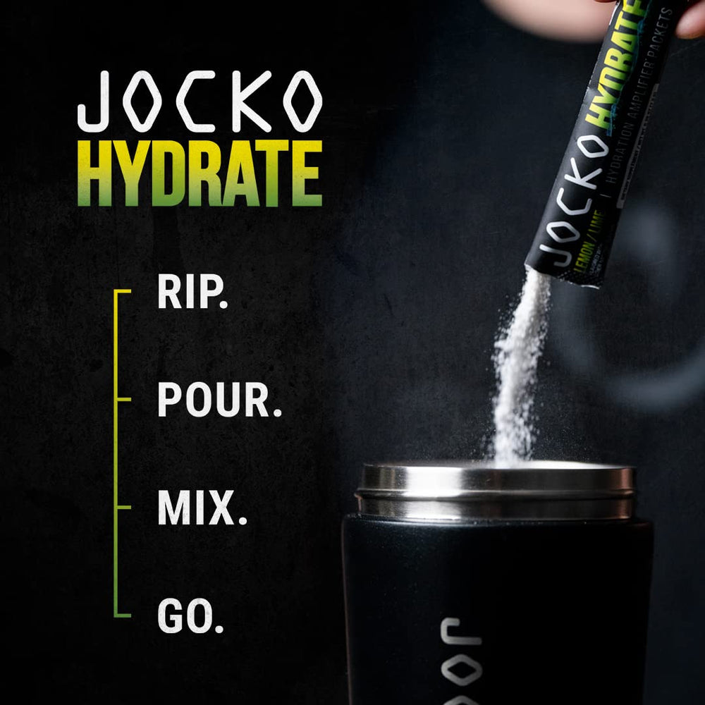 Jocko Fuel Lemon Lime bottle beside glass ready for training hydration