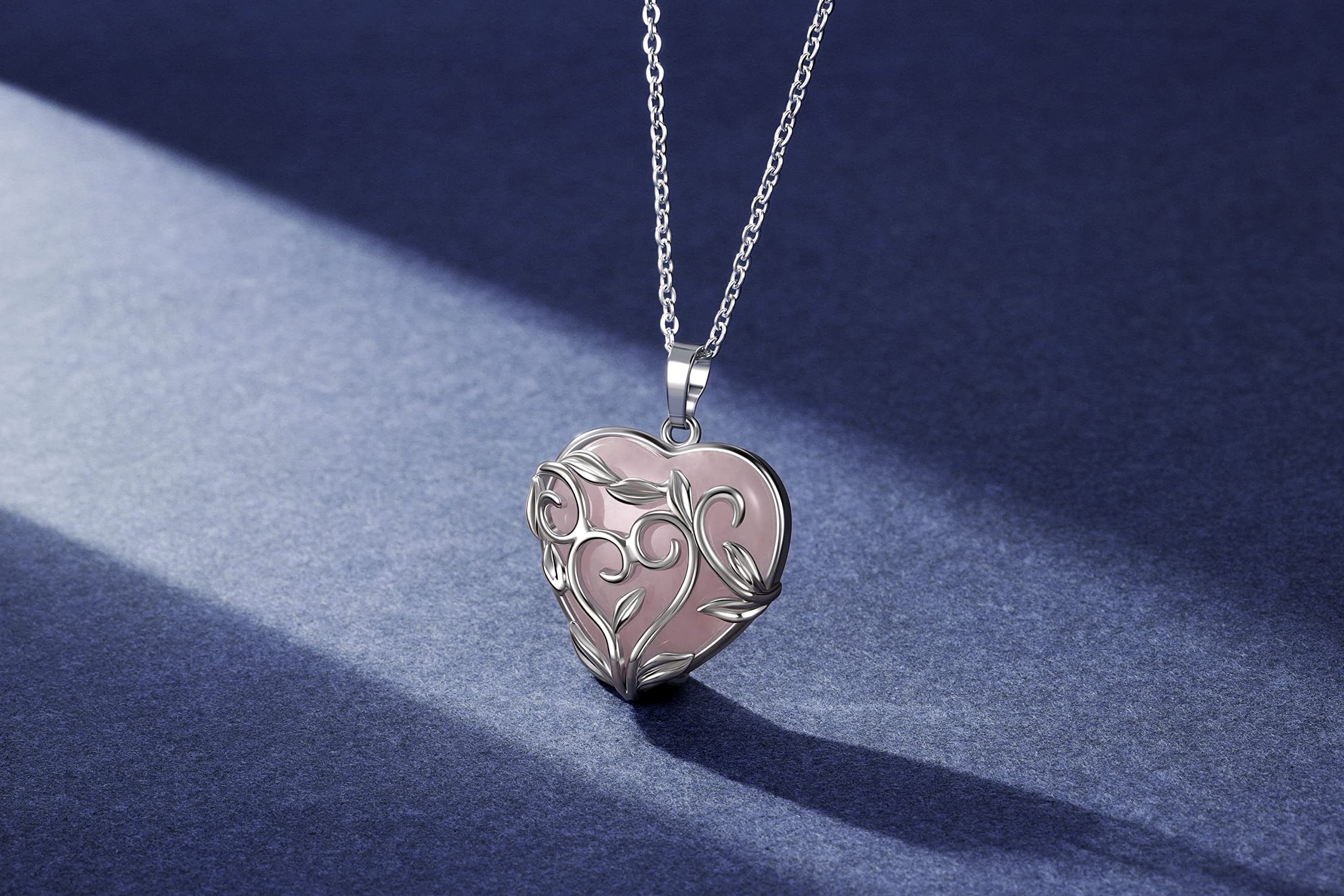 Jovivi leaf-wrapped design around rose quartz adds artisanal style.