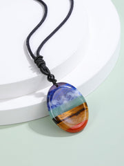 Jovivi oval crystal pendant close-up showing 30x40mm stone for grounding