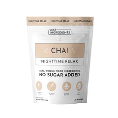 Just Ingredients Chai Nighttime Relax bottle beside a cozy mug for calm evenings.