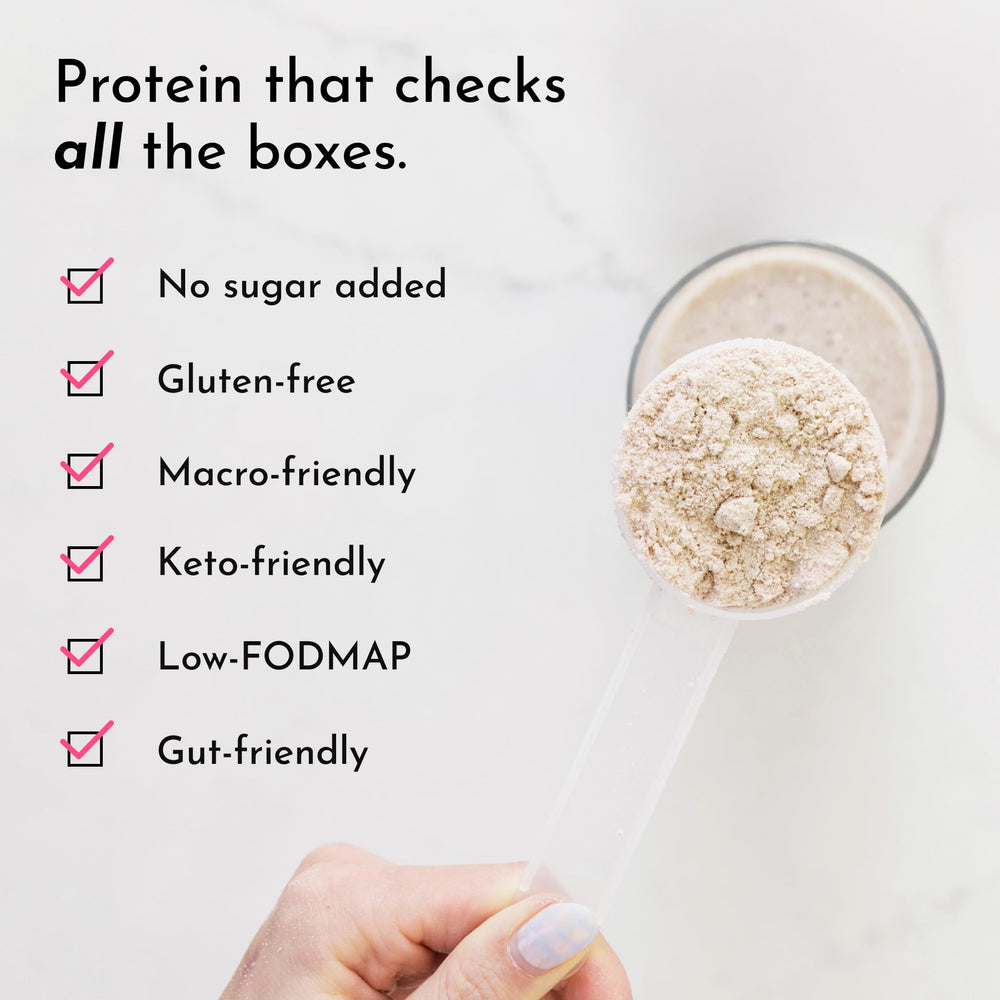 Pouring vanilla bean protein powder into a blender for smoothies.