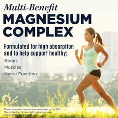 A person holding Kal Triple Source Magnesium bottle for convenient daily supplementation
