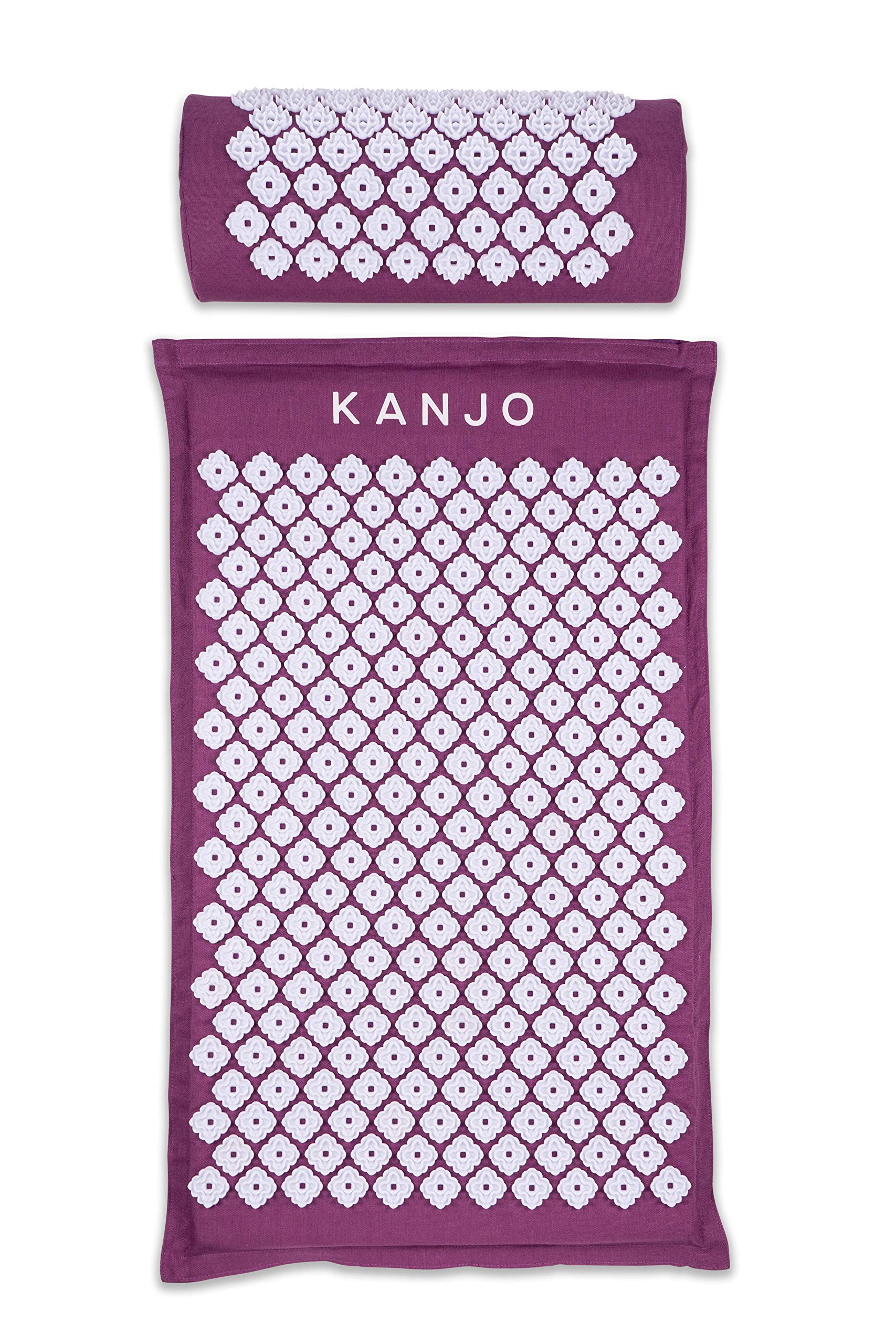 Kanjo acupressure mat in amethyst on bed, targeting back pressure points for relaxed muscles.