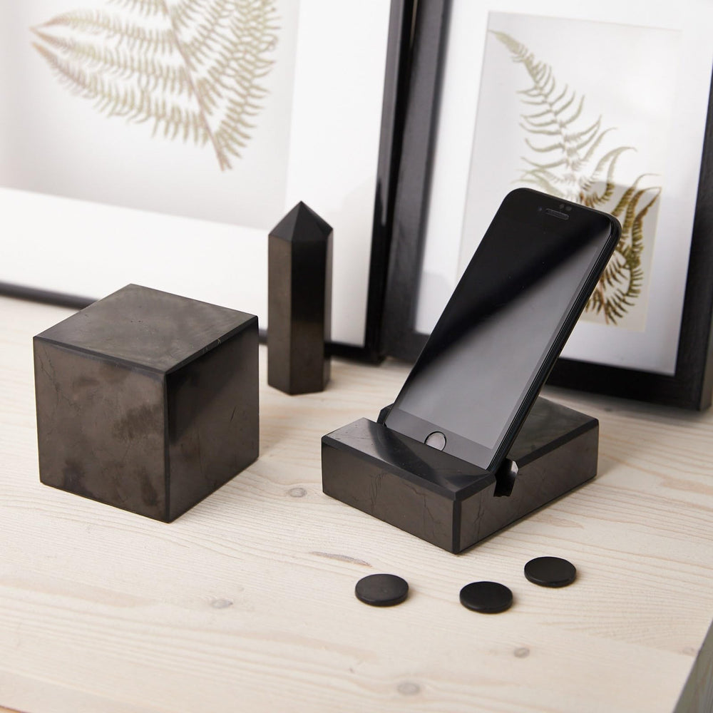 Karelian Heritage shungite stone plate on a laptop for portable use.