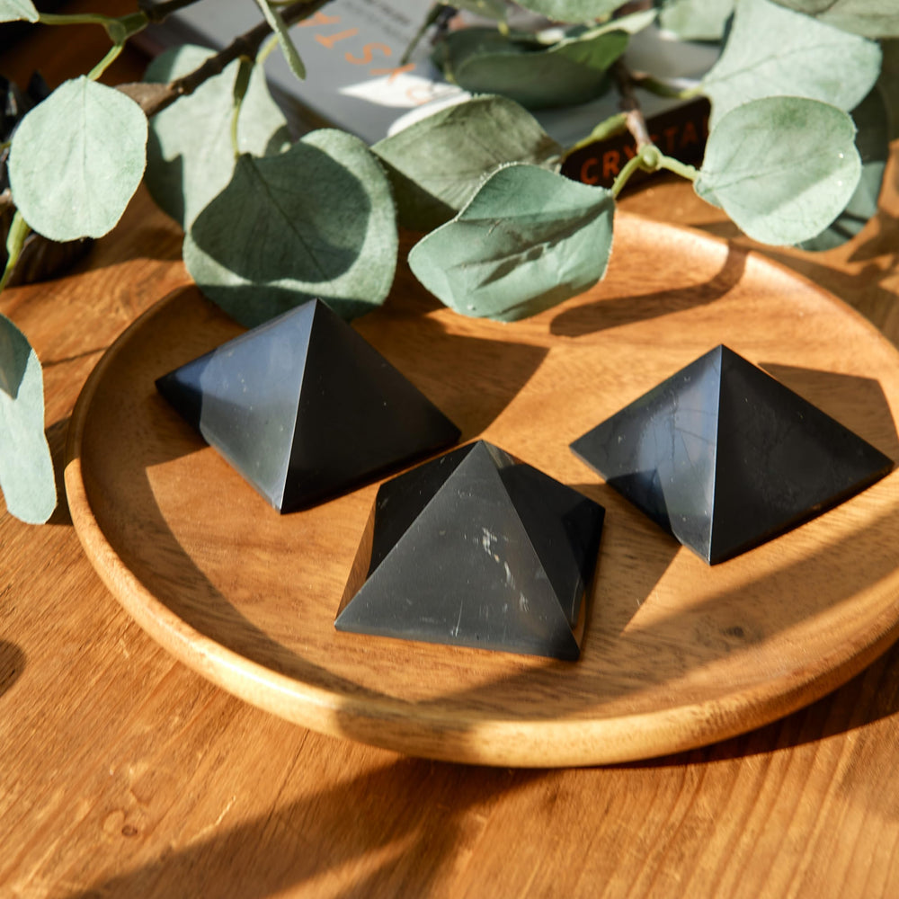 Karelian Heritage shungite pyramid on office desk for focus and balance.