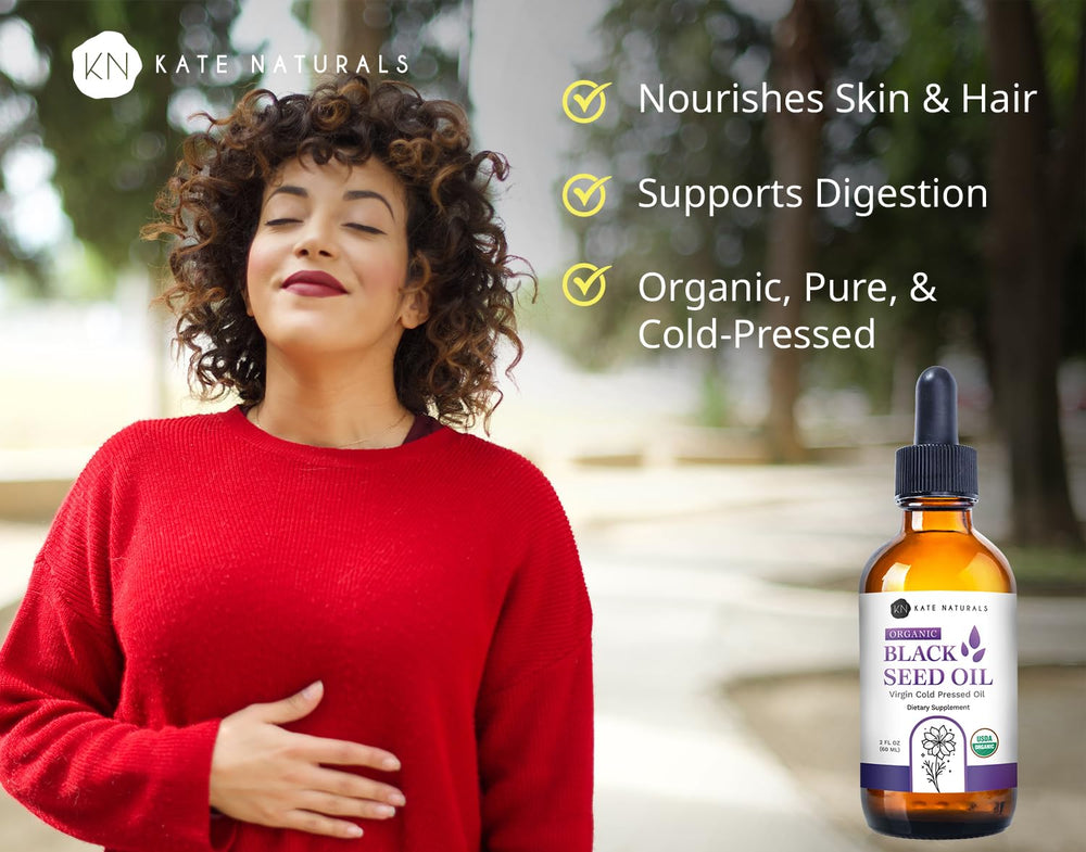 Pouring Kate Naturals Black Seed Oil shows smooth oil flow ideal for topical application.