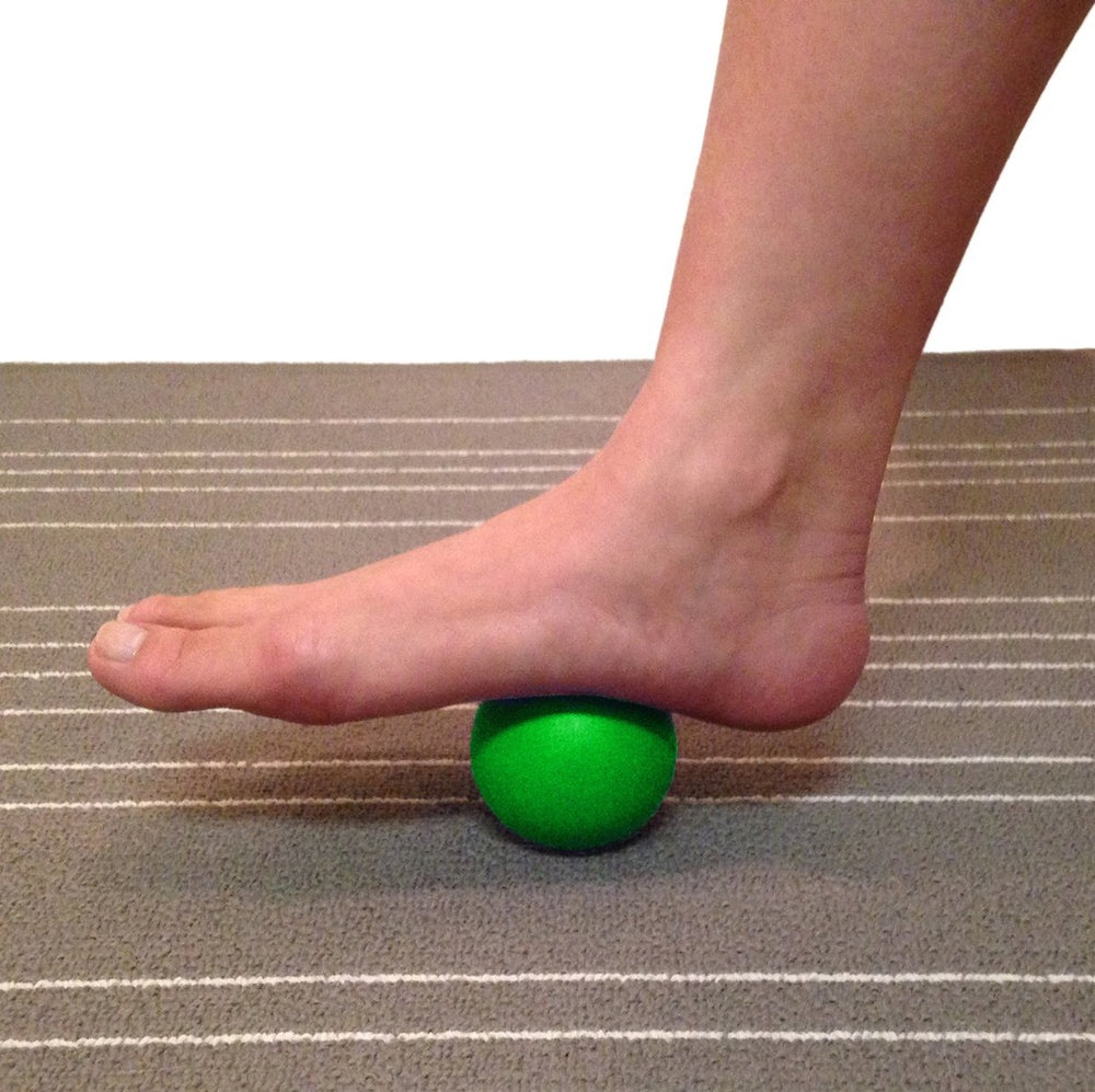 Kieba Lacrosse Balls on yoga mat used for back release