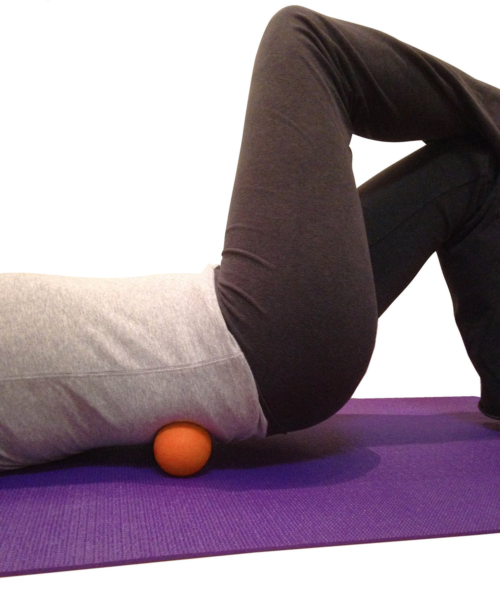 Kieba lacrosse balls orange on shoulders, roll to ease tension and trigger points.