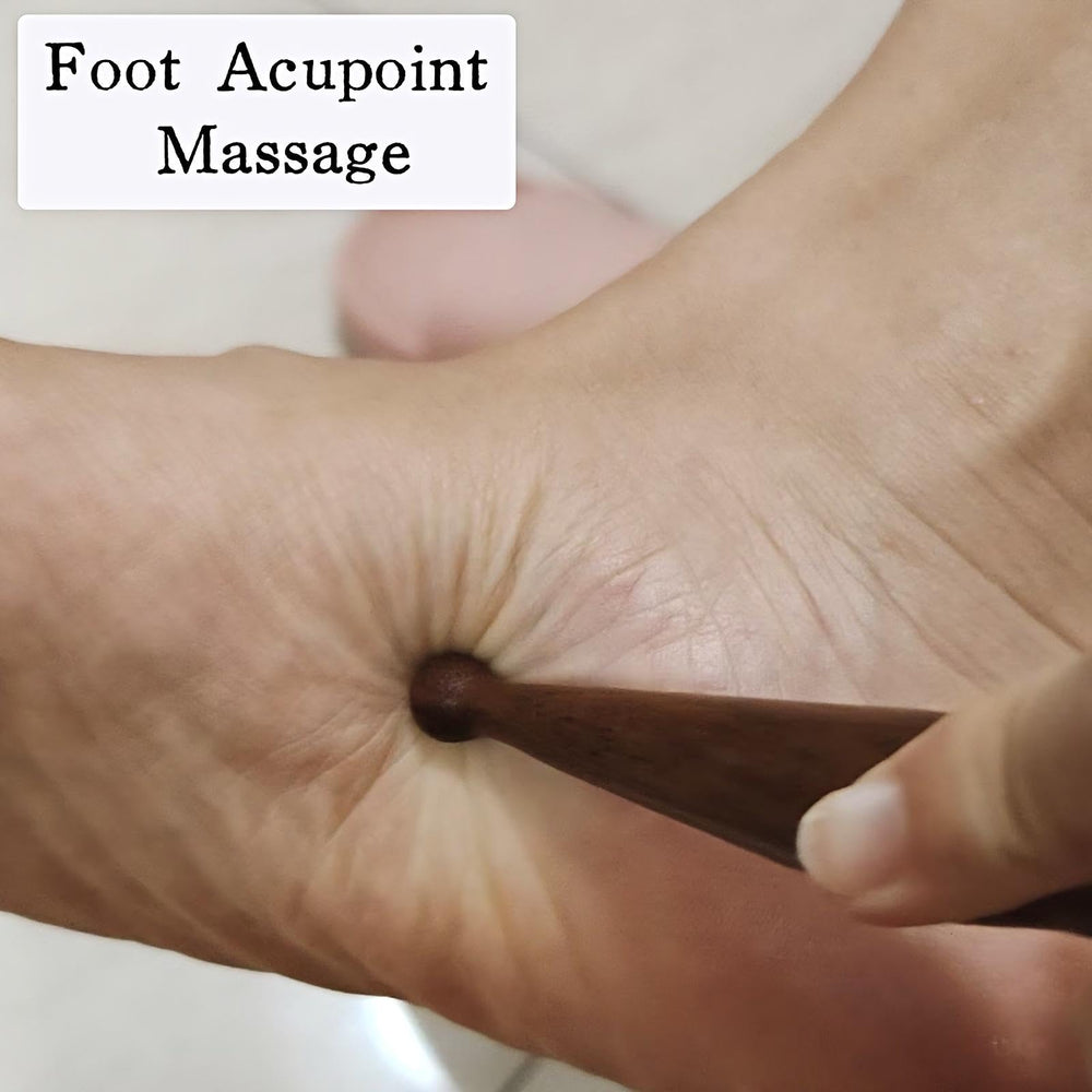 KINTEGOOD sandalwood acupoint pen in use hand demonstrates massage action.