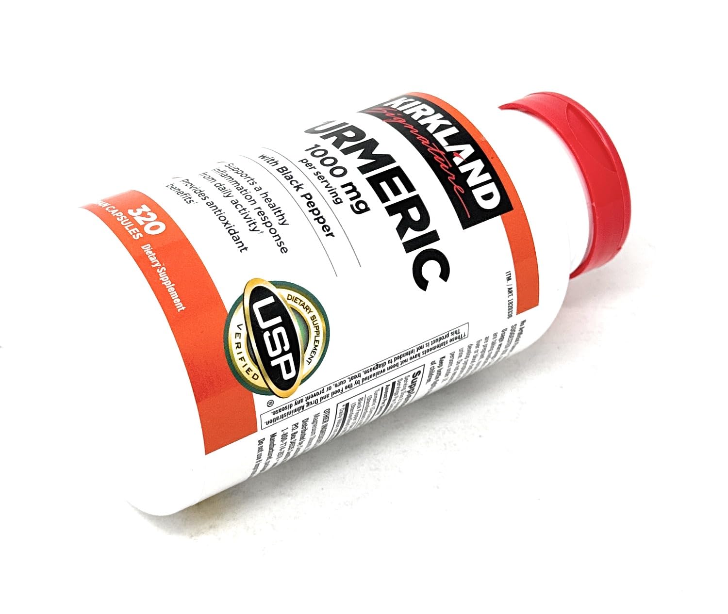 KIRKLAND Turmeric packaging display on a store shelf.