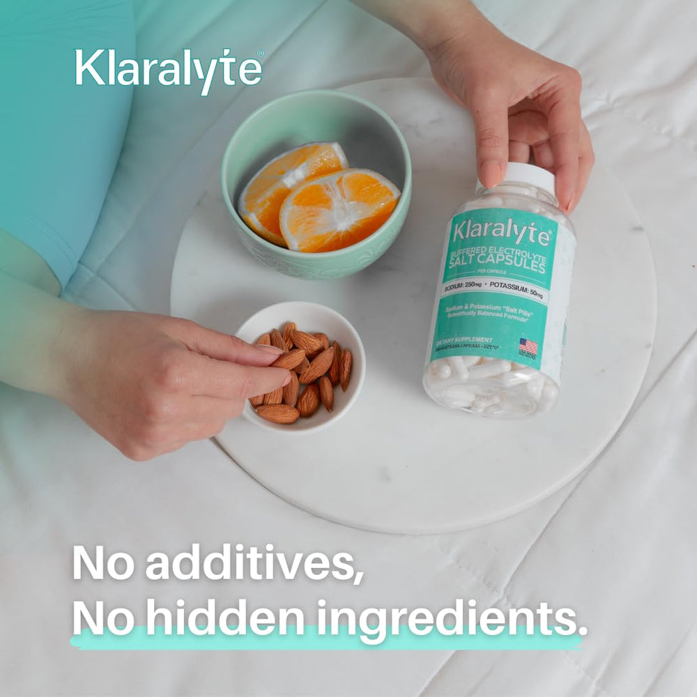 KLARALYTE daily-use setup with bottle and glass of water.