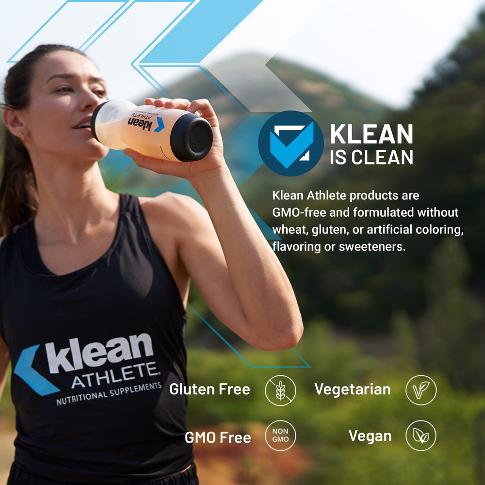 Klean Athlete Klean BCAA + Peak ATP being mixed in a glass of water.