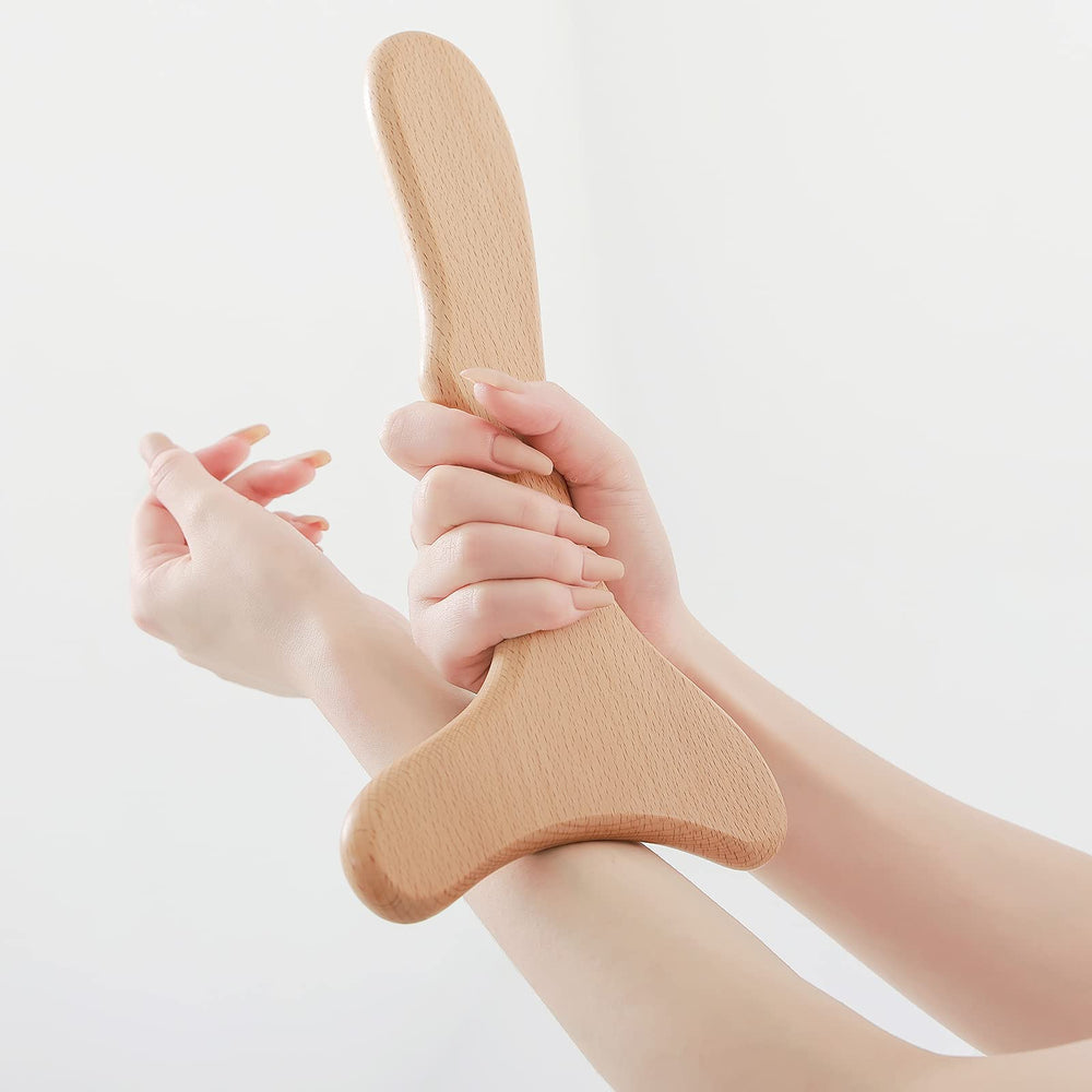 Komogir wood massager lateral profile highlights durable construction for lymphatic work.