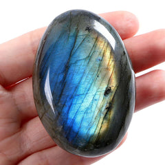 LAIDANLA Labradorite palm stone in hand highlighting portability and energy balancing on the go.
