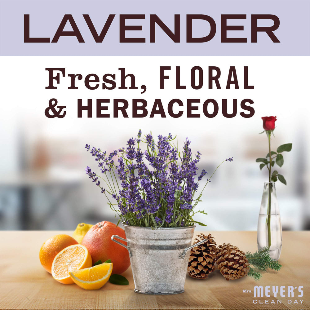 Lavender flowers beside hand sanitizer suggesting natural fragrance.