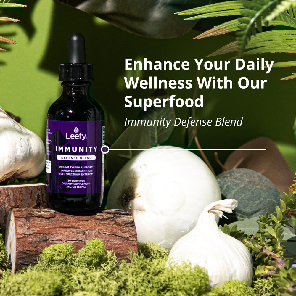 Leefy Organics Immunity Defense Blend dropper delivering fast-absorbing liquid.