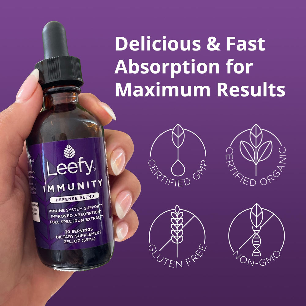Leefy Immunity Defense Blend bottle on counter with fresh herbs.
