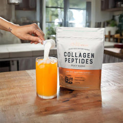 Live Conscious Collagen Peptides Peach Mango scoop showing quick-dissolve powder.