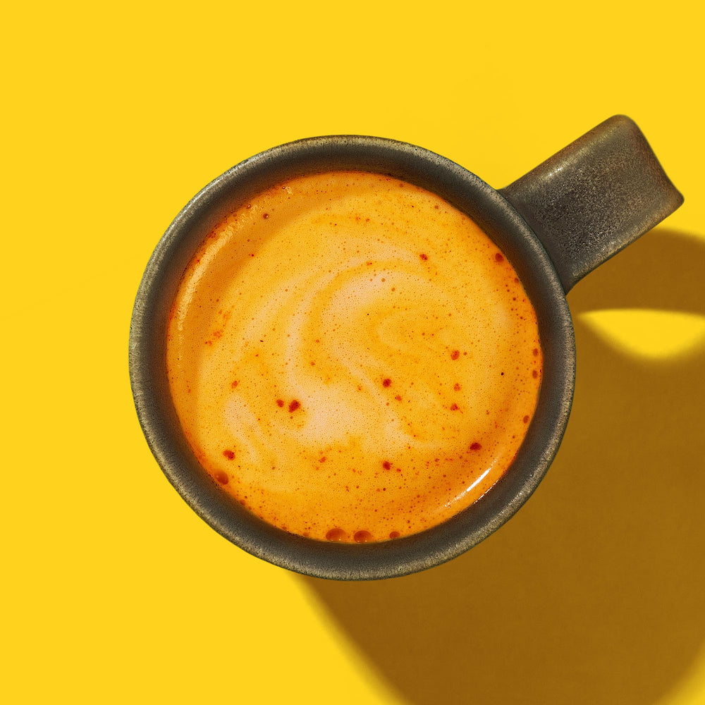 Live It Up Golden Hour pour-in-cup shows creamy latte texture.