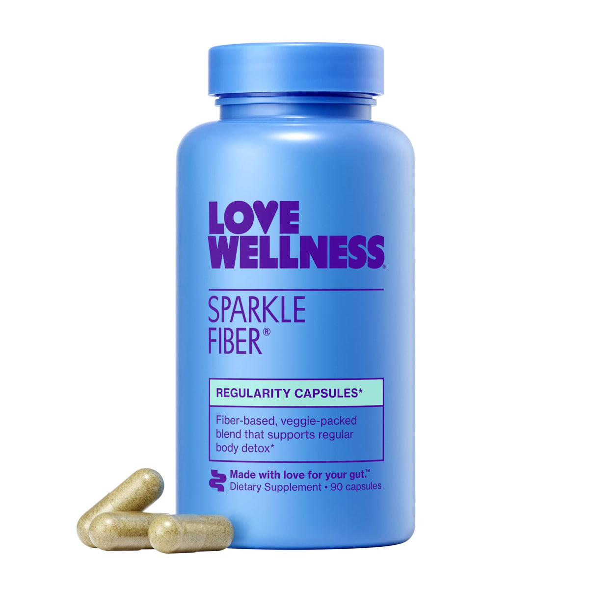 Love Wellness Sparkle Fiber bottle being poured into a glass for digestion support.