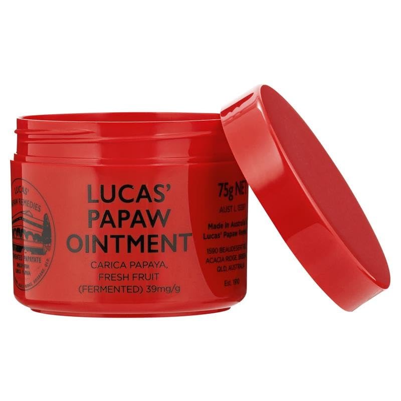 Lucas Papaw Ointment applied on lips for moisturized comfort.