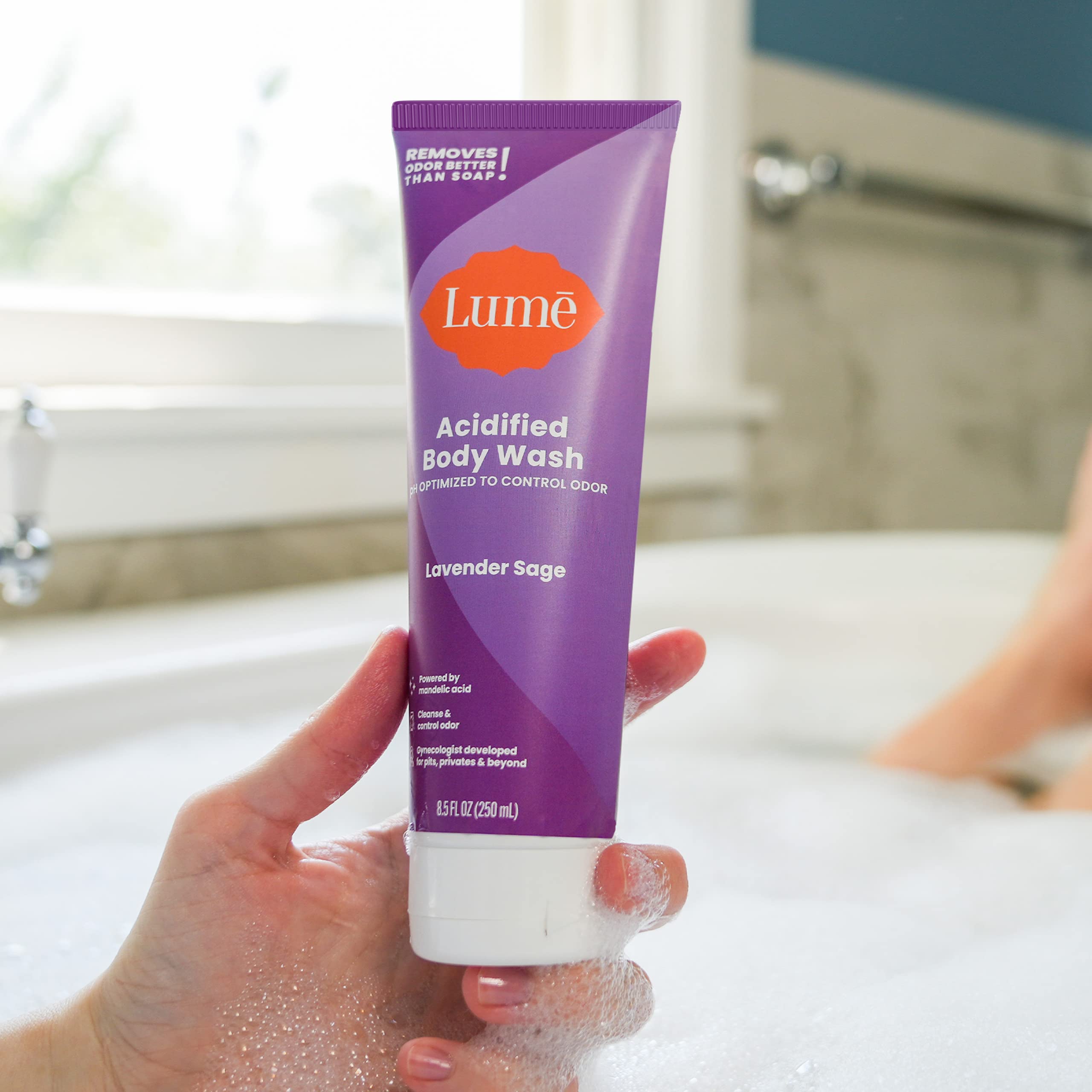 Lume Acidified Body Wash hands-pouring suggests easy transfer to daily routines.