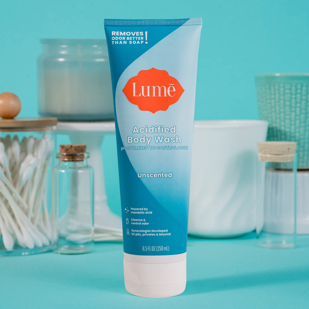 Lume Acidified Body Wash label close-up highlights 8.5 oz size and unscented formula.