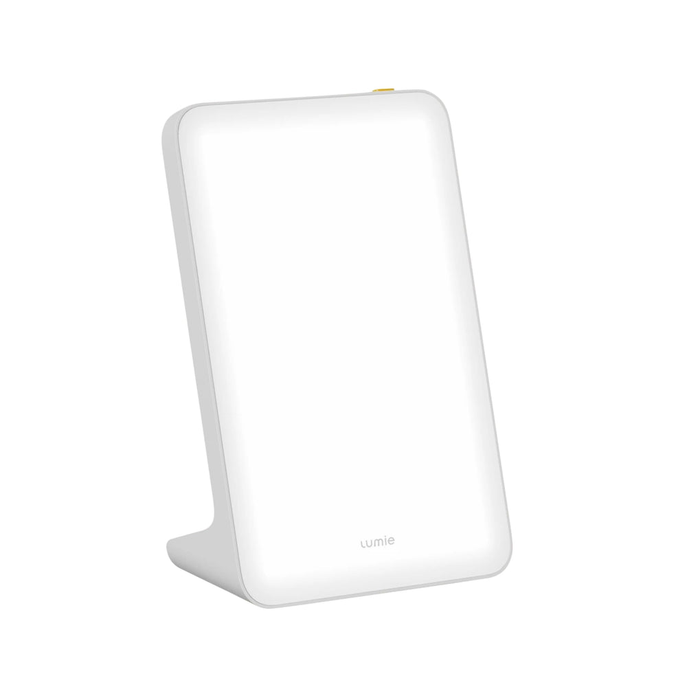 Lumie Mini Lamp on a desk delivering bright daylight-like light for daytime energy