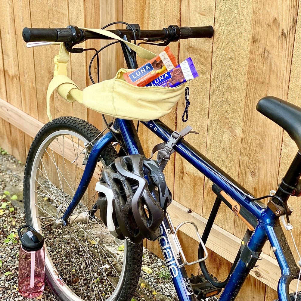 Luna Bar on-the-go snack in hand, showing convenient individually wrapped format.