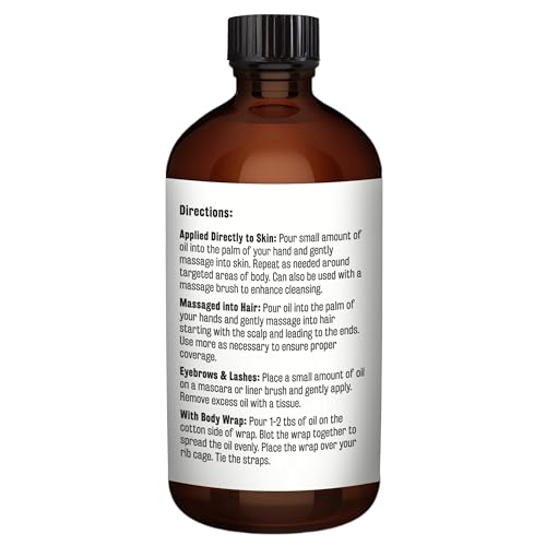 M3 Naturals castor oil pour closeup on glass bottle.