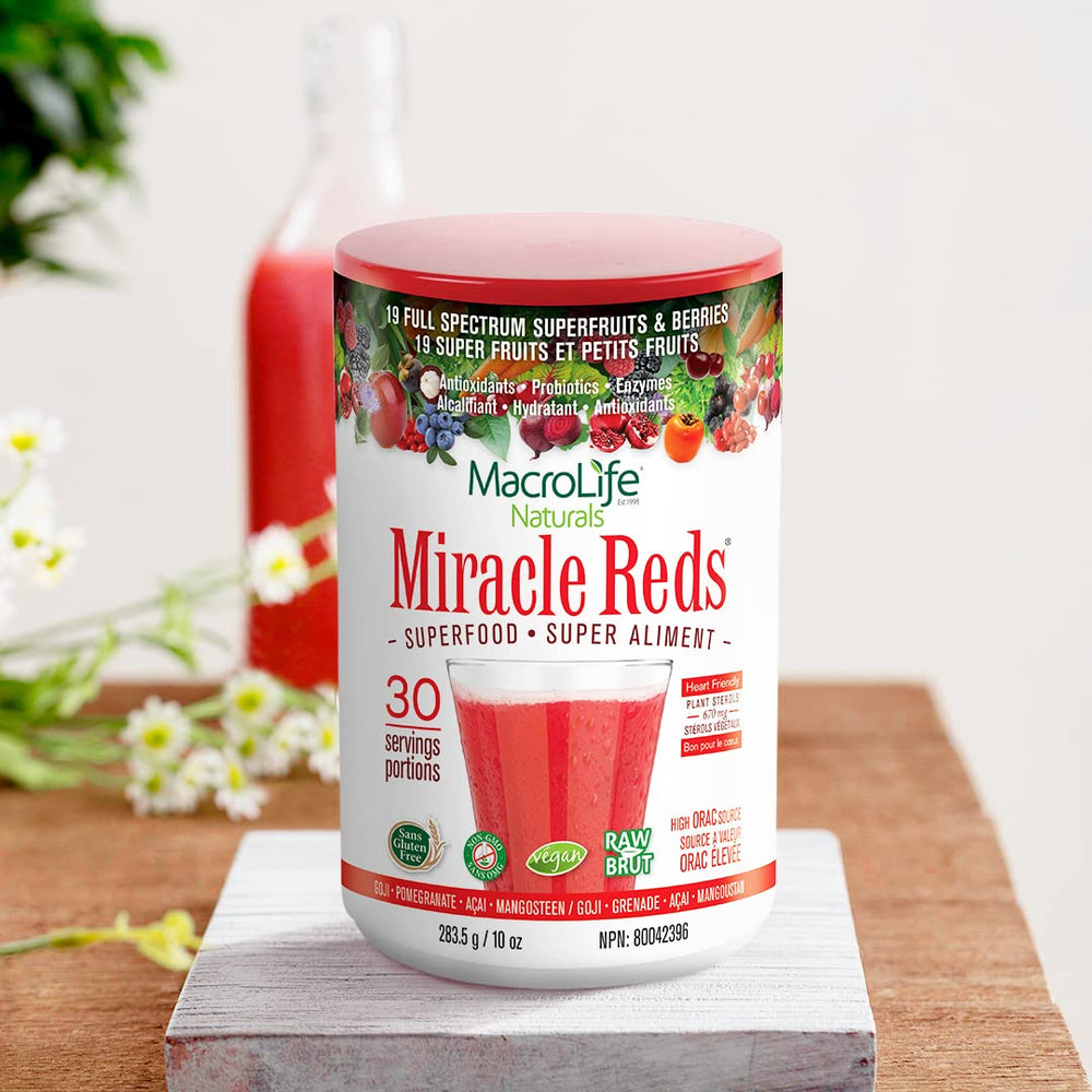 MacroLife Naturals Miracle Reds daily-use scoop being added to a shake.