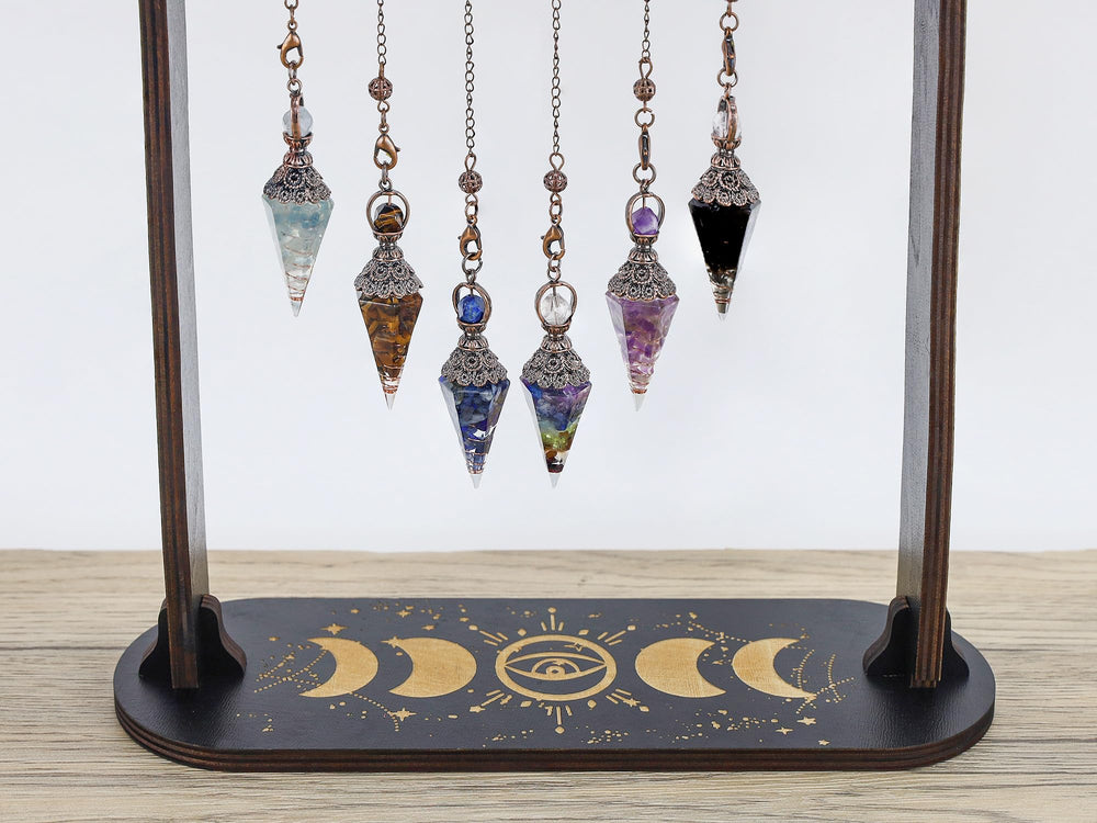 Maibaota aquamarine pendulum in hand for meditation and guidance