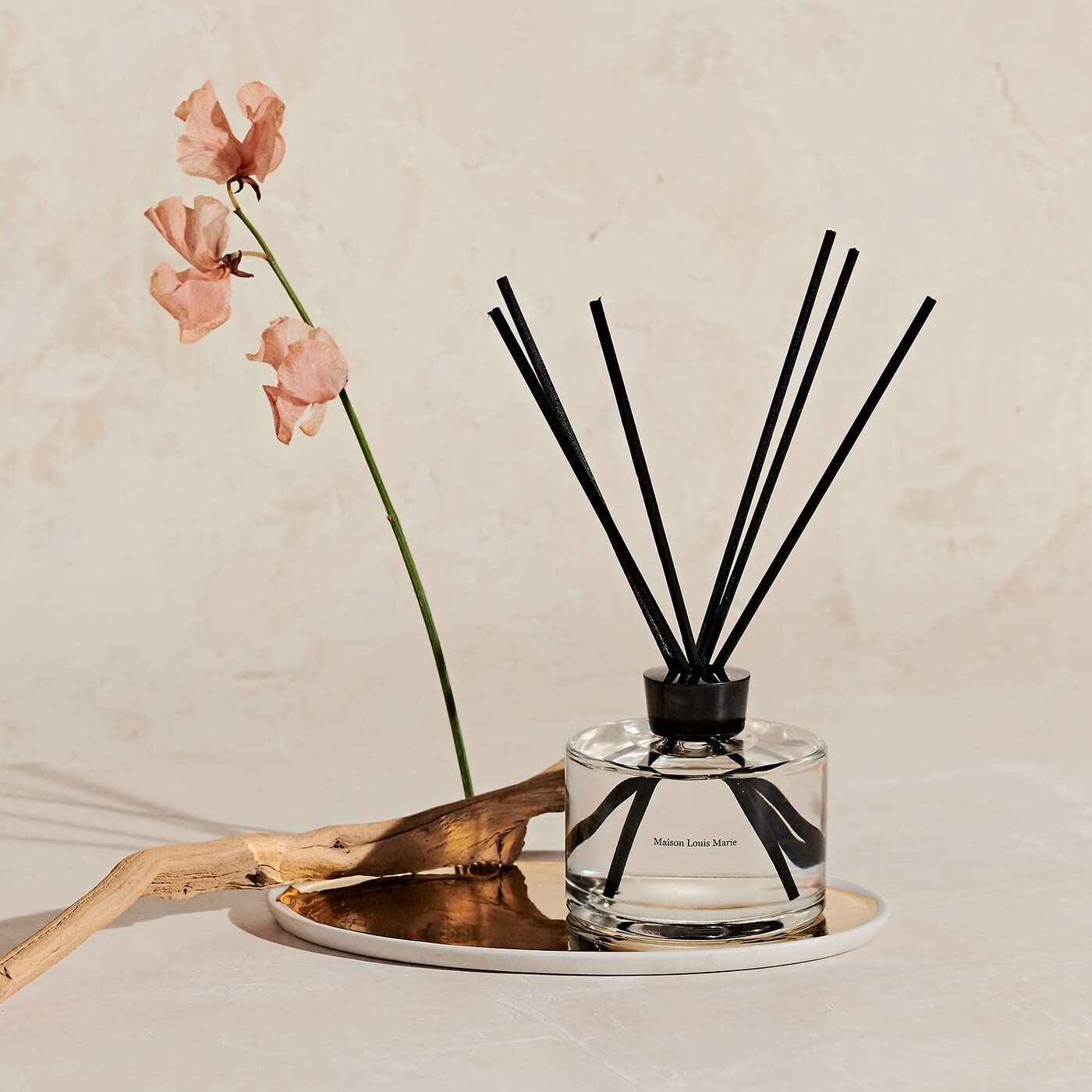 Maison Louis Marie No.04 diffuser reeds releasing fragrant aroma across room