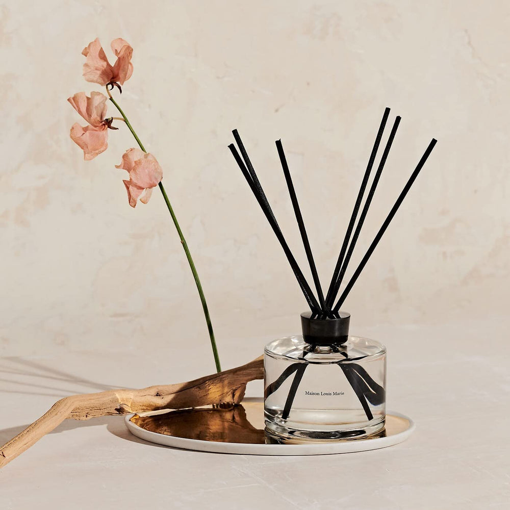 Maison Louis Marie No.04 diffuser reeds releasing fragrant aroma across room