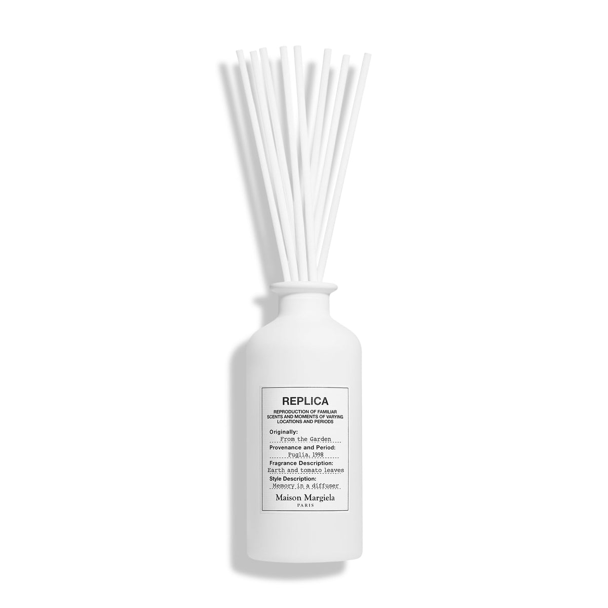 Maison Margiela Replica Garden diffuser bottle close-up showing minimalist design for modern spaces.