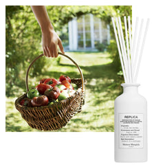Maison Margiela Replica Garden diffuser label detail highlights iconic REPLICA branding.