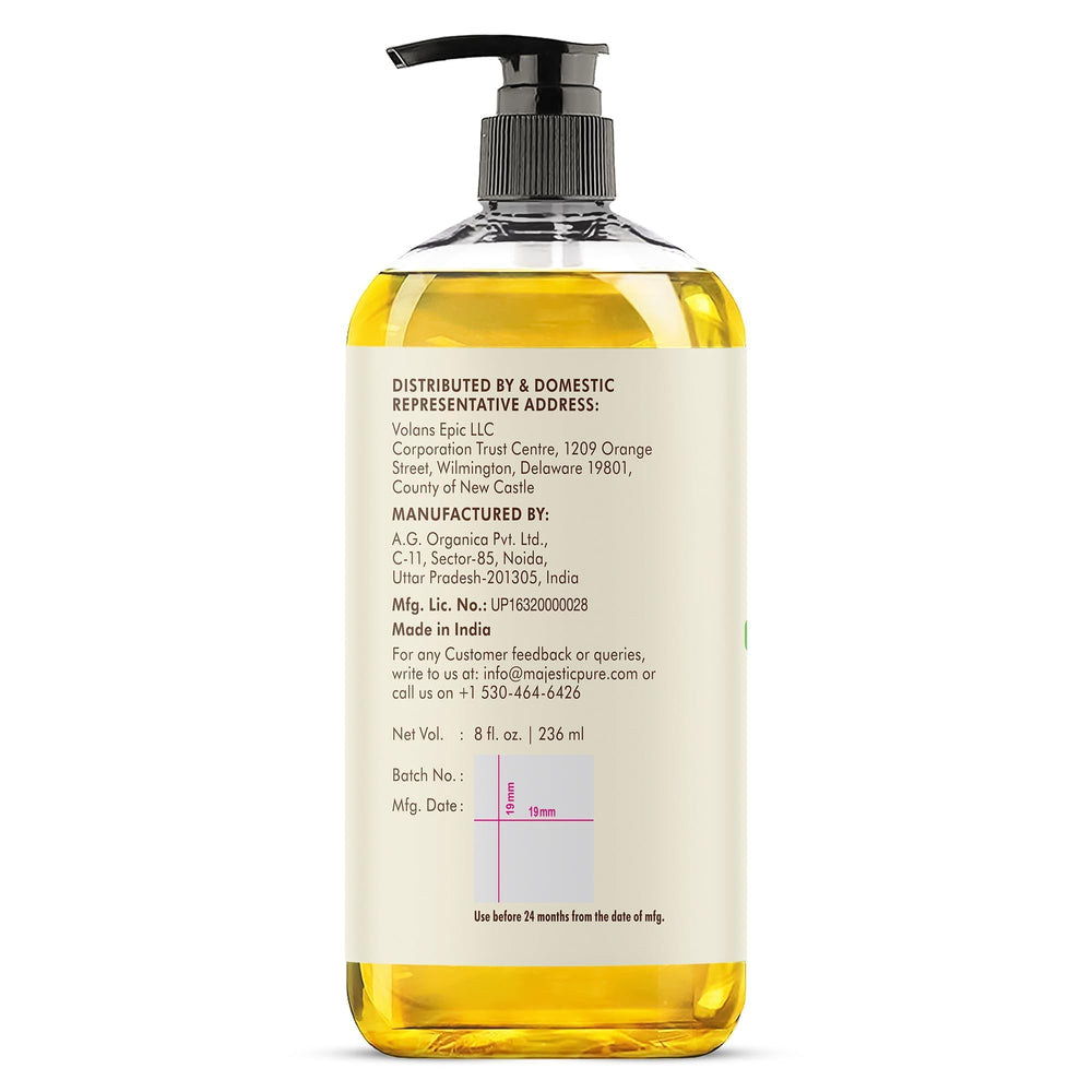 Majestic Pure coconut massage oil on palm ready for deep tissue sessions