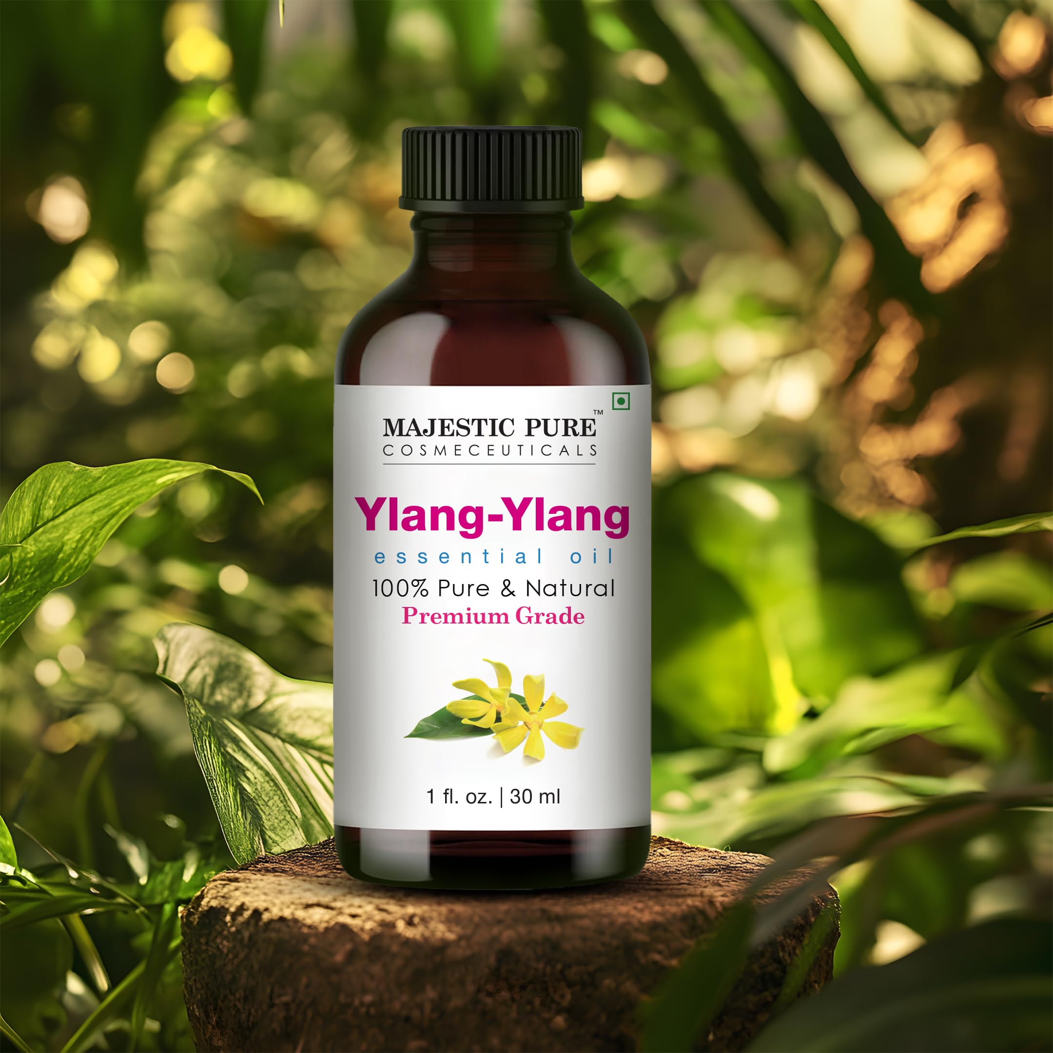 Majestic Pure Ylang Ylang oil beside diffuser for calming aromatherapy.