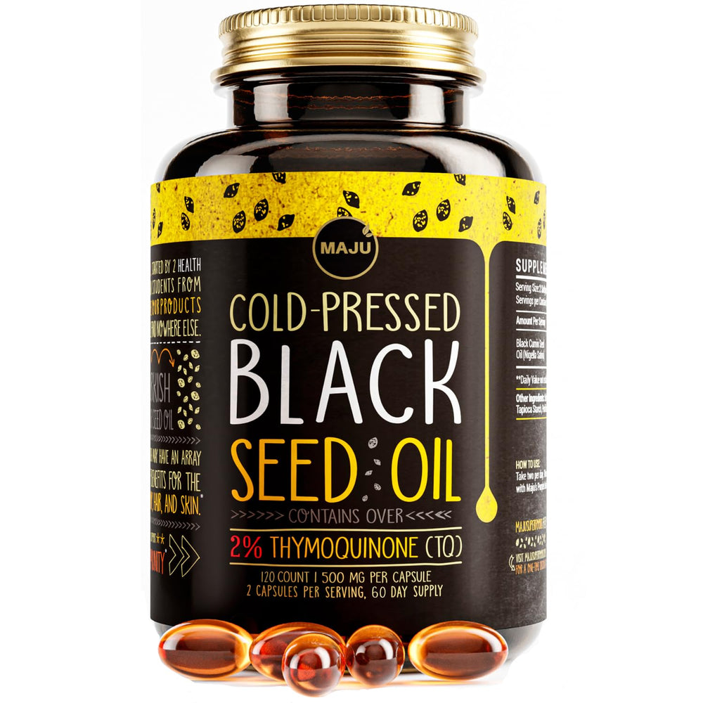 Maju Superfoods black seed oil capsules bottle on kitchen counter for daily use.