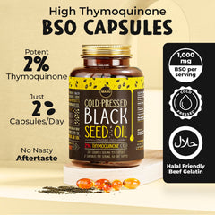 Maju Superfoods nigella sativa oil pour close-up, golden herbal liquid.
